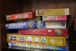 A COLLECTION OF BOARD GAMES AND JIGSAWS