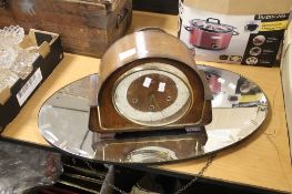 A MANTLE CLOCK AND MIRROR