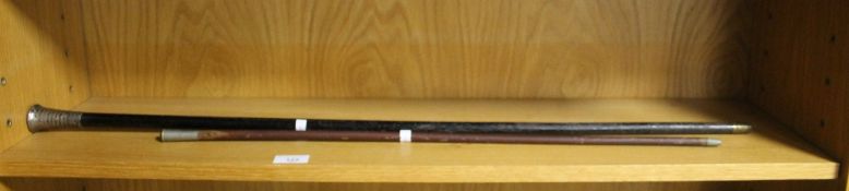 A SILVER TOPPED CANE TOGETHER WITH A SWAGGER STICK