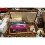 A PICNIC BASKET AND A SMALL SELECTION OF GAMES ETC