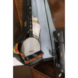 A VINTAGE CLIFFORD ESSEX AND CO BANJO WITH MOTHER OF PEARL INLAY