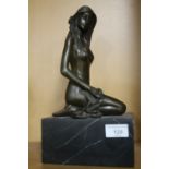 A BRONZE TYPE FIGURE OF A LADY