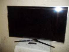 A SAMSUNG 56" CURVE TV A/F WITH REMOTE