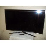 A SAMSUNG 56" CURVE TV A/F WITH REMOTE