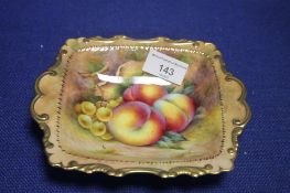 A HAND PAINTED FRUIT PATTERN DISH SIGNED R BUDD
