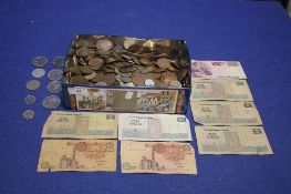 A TIN OF COINS AND BANKNOTES