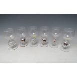 A SET OF SIX STEVENS & WILLIAMS STEMMED NOVELTY WINE GLASSES WITH LAMPWORK EQUESTRIAN SCENES TO