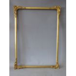 A LATE 19TH / EARLY 20TH CENTURY DECORATIVE GOLD WATERCOLOUR FRAME, with corner embellishments,