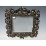 A 19TH CENTURY CONTINENTAL EBONISED AND GILT CARVED DECORATIVE FRAME, glazed, frame W 7.5 cm, rebate