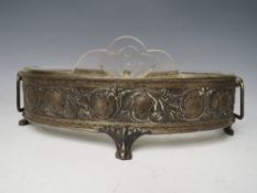 AN ART NOUVEAU OVAL WHITE METAL JARDINIAIRE WITH GLASS LINER, W 26.5 cm