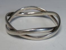 GEORG JENSEN. A George Jensen heavy crossover style bangle, approx Dia. 7.1 cm, stamped Georg