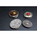 A SELECTION OF FOUR SILVER AND WHITE METAL PILL BOXES