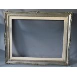 A 20TH CENTURY CARVED WOODEN SILVERED FRAME WITH PAINTED SLIP, frame W 8 cm, slip rebate 80 x 60 cm,