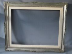 A 20TH CENTURY CARVED WOODEN SILVERED FRAME WITH PAINTED SLIP, frame W 8 cm, slip rebate 80 x 60 cm,