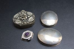 A COLLECTION OF FOUR SILVER AND WHITE METAL PILL BOXES