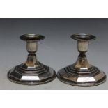 A PAIR OF WHITE METAL SQUAT CANDLESTICKS OF UNUSUAL DESIGN, H 8.5 cm