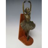 A DECORATIVE BRONZED STYLE BALLET DANCER, mounted on a hardwood plinth, H 26.5 cm