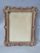 A LATE 19TH / EARLY 20TH SMALL DECORATIVE CARVED WOODEN FRAME, glazed, frame W 3 cm, rebate 21 x