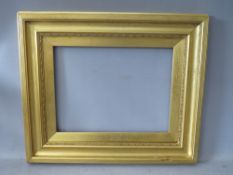 A 19TH CENTURY GOLD FRAME, with decoration to inner edge and gold slip, frame W 6.5 cm, slip