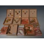 A COLLECTION OF KIRKS FOLLY COSTUME JEWELLERY AND PIN BADGES ETC., to include four boxed sets of pin