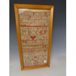 A FRAMED VICTORIAN NEEDLEWORK SAMPLER, dated 1887, framed and glazed, 41 x 19 cm