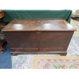 A 19TH CENTURY OAK MULE CHEST, the typical hinged lid bearing brass plaque 'William Powell