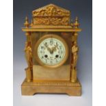 A FRENCH BRASS / BRONZE GILDED MANTEL CLOCK, the movement stamped S. Marti, retailed by Harris of