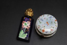 A PAINTED BLUE GLASS PERFUME BOTTLE, together with a French style enamel pill box (2)