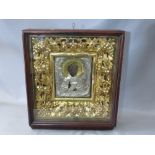 A LATE 18TH / EARLY 19TH CENTURY BOXED AND GLAZED DECORATIVE GOLD FRAME, containing a faded Icon