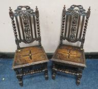 A PAIR OF CARVED OAK JACOBEAN STYLE CHAIRS, with typical barleytwist supports (2)