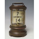 A LATE 19TH / EARLY 20TH CENTURY TICKET CLOCK, the brass case of cylindrical form with two sets