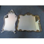 A 20TH CENTURY ORNATE CARVED WOODEN SILVERED FRAMED MIRROR, 59 x 39 cm (widest), together with a