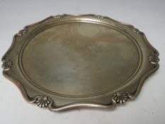 A HALLMARKED SILVER SALVER - SHEFFIELD 1911, with engraved dedication to reverse, approximate weight