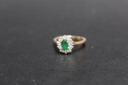 A HALLMARKED 9 CARAT GOLD EMERALD AND DIAMOND RING, approx weight 3.4g, ring size M