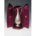 A HALLMARKED SILVER EWER IN FITTED CASE - LONDON 1872, makers mark for AM, of bulbous form with