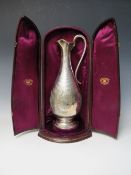 A HALLMARKED SILVER EWER IN FITTED CASE - LONDON 1872, makers mark for AM, of bulbous form with