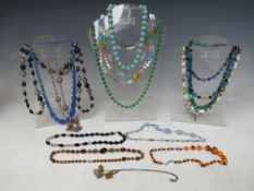A COLLECTION OF VINTAGE AND GLASS BEAD NECKLACES, to include satin glass, malachite and filigree