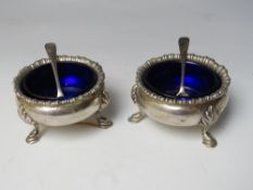 A PAIR OF HALLMARKED SILVER SALTS WITH BLUE GLASS LINERS - LONDON 1903, makers mark for SWS & Co.,