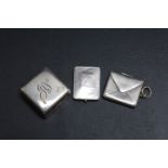 THREE SMALL SILVER BOXES, to include an envelope shaped stamp holder