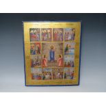 A RUSSIAN ICON ON PANEL, the central work surrounded by twelve smaller scenes, gilt decoration and