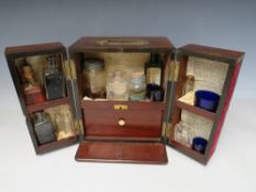 A GEORGE III MAHOGANY TABLE TOP APOTHECARY CABINET, the twin doors opening to a fitted interior with