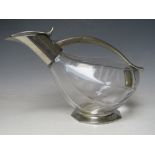 AN ETAINS DU MANOIR DECANTER IN THE FORM OF A DUCK, glass body with metal mounts, overall L 27 cm