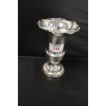 A HALLMARKED SILVER TRUMPET VASE, having filled base and frilled rim, H 14 cm