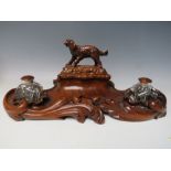 A LATE 19TH / EARLY 20TH CENTURY MAHOGANY DESK TIDY, with pair of inkwells and carved wooden lid