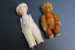 A MINIATURE DOLL TOGETHER WITH AN EVEN SMALL MONKEY, (2)
