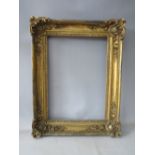 A LATE 18TH / 19TH CENTURY GOLD FRAME, with ornate corners, frame W 8 cm, rebate 51 x 37 cm