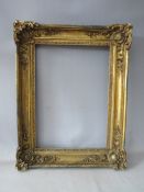 A LATE 18TH / 19TH CENTURY GOLD FRAME, with ornate corners, frame W 8 cm, rebate 51 x 37 cm