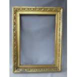 A 19TH CENTURY GOLD FRAME, with carved wood inset and gold slip, frame W 8 cm, slip rebate 82 x 57