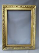 A 19TH CENTURY GOLD FRAME, with carved wood inset and gold slip, frame W 8 cm, slip rebate 82 x 57