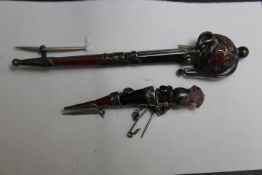 TWO SCOTTISH STYLE AGATE BROOCHES, in the style of a dirk and a broadsword, longest L 8.75 cm